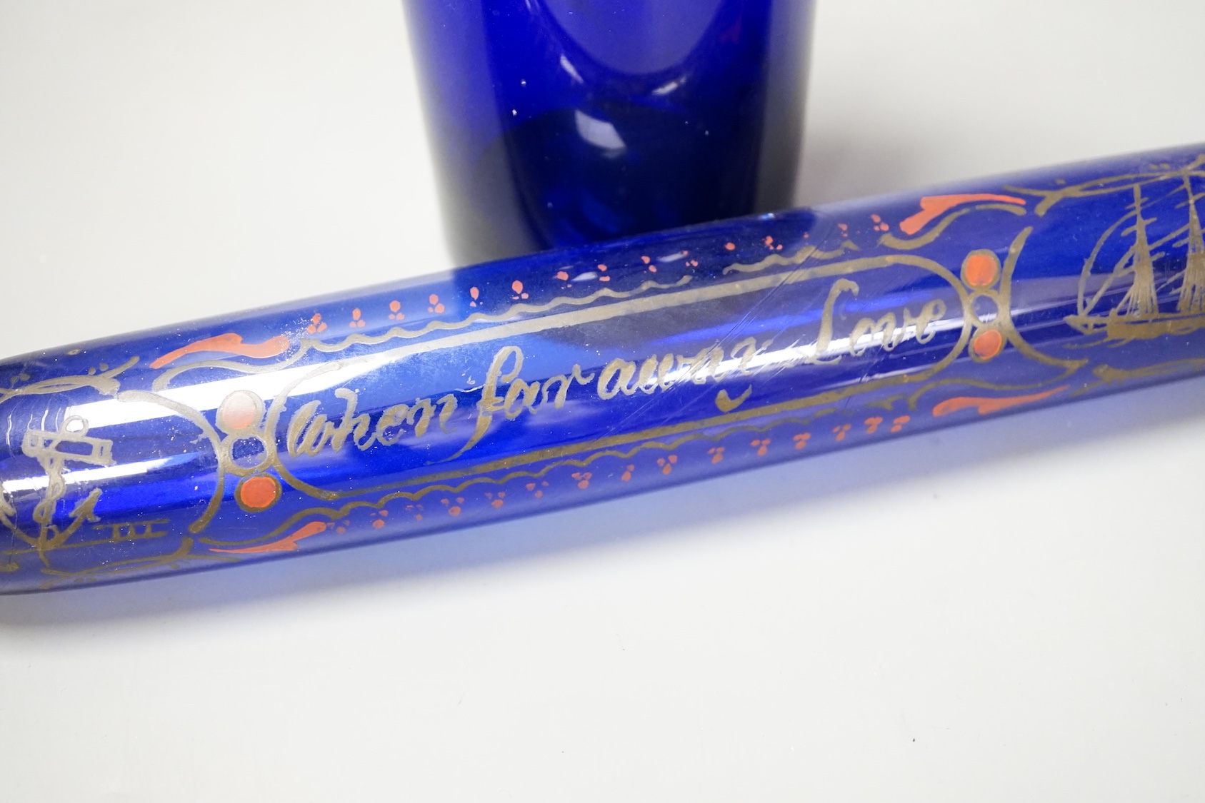A Victorian cobalt blue glass apothecary jar and a rolling pin (2)